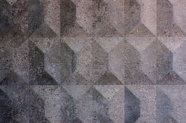 Kerámia lapok textúrája dombornyomású rombuszokkal és piramisokkal, szemcsés felülettel. Szürke geometriai mértani háttér - Fotó, kép