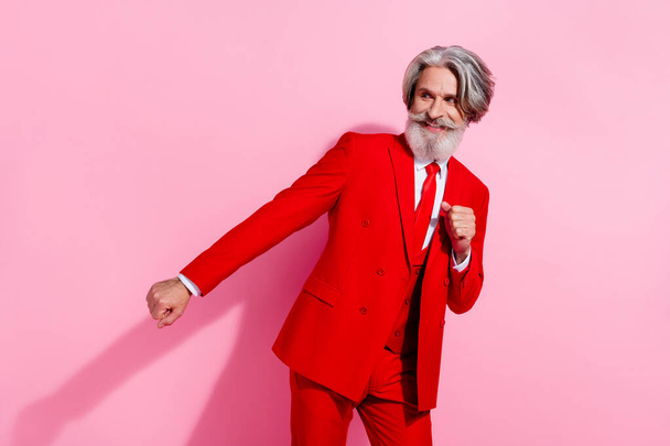 Photo of charming funny retired man wear red suit dancing empty space isolated pink color background - Foto, Imagem
