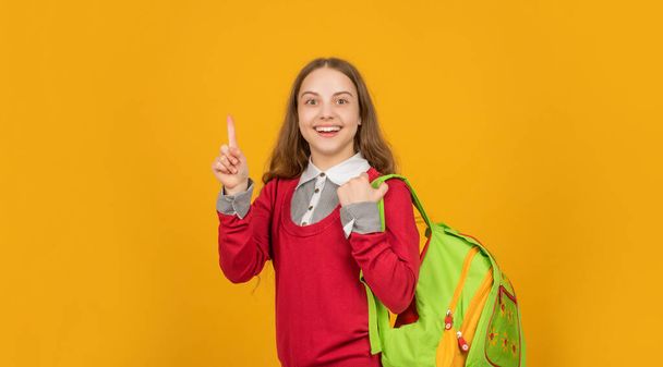 happy inspired with idea teen girl with school backpack on yellow background, school - Photo, image