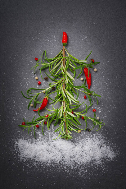 Minimalist Flat lay of herbs and spices in shape of a Christmas tree, Top view, Christmas concept. - Foto, Imagem