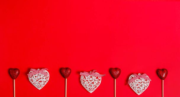 White and shiny hearts on a red background for Valentines Day - 写真・画像