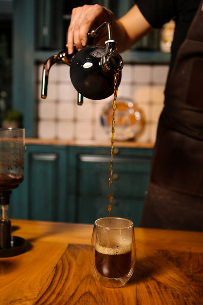 barista brewing coffee in the coffee room - Fotó, kép