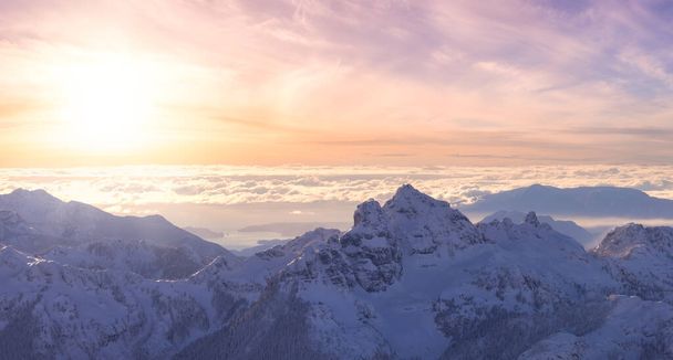 Aerial Panoramic View of Canadian Mountain covered in snow - Fotoğraf, Görsel