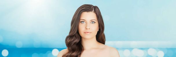 Wellness model and beauty face closeup. Beautiful brunette woman with natural organic cosmetics makeup and long hairstyle as spa, skincare and glamour portrait - Photo, Image