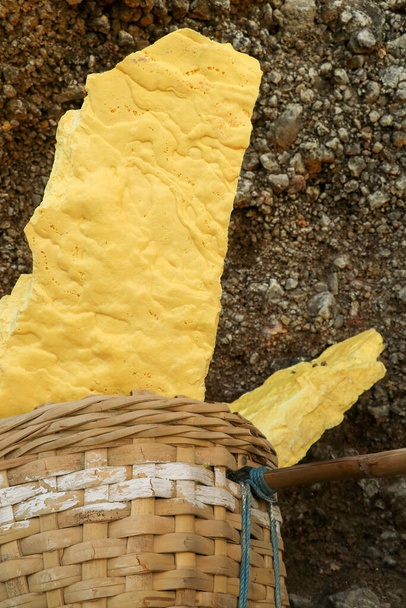 yellow sulfur inside woven bamboo basket at volcanic crater Kawah Ijen - Photo, Image