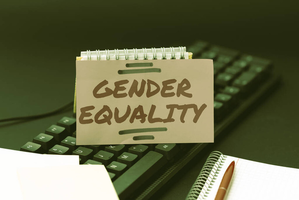 Writing displaying text Gender Equality. Word for access to same privilege given to both men and women Typing Online Website Informations, Editing And Updating Ebook Contents - Foto, immagini