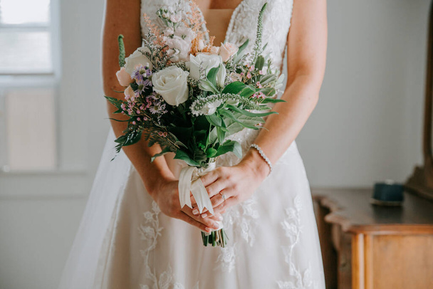 beautiful bride with wedding bouquet in hands - Zdjęcie, obraz