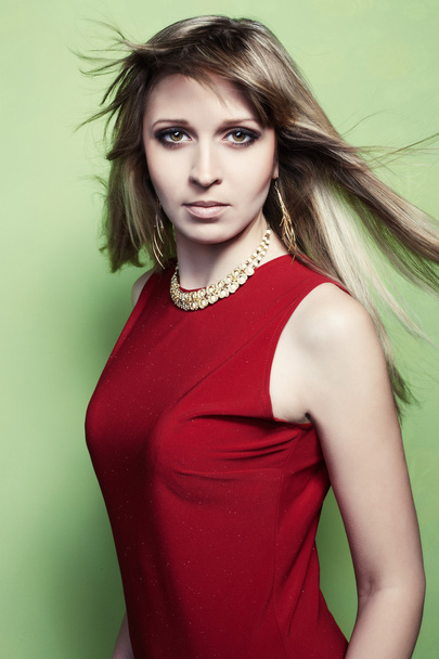 Portrait of the blonde woman in a red dress - Foto, immagini