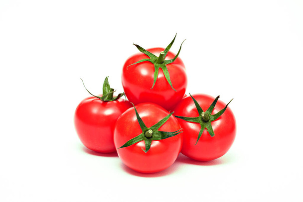  A bunch of organic ripe red tomatoes on a white background. - Photo, Image