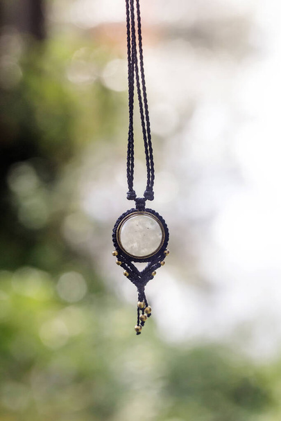 Boho necklace on natural background with white moonstone - Φωτογραφία, εικόνα