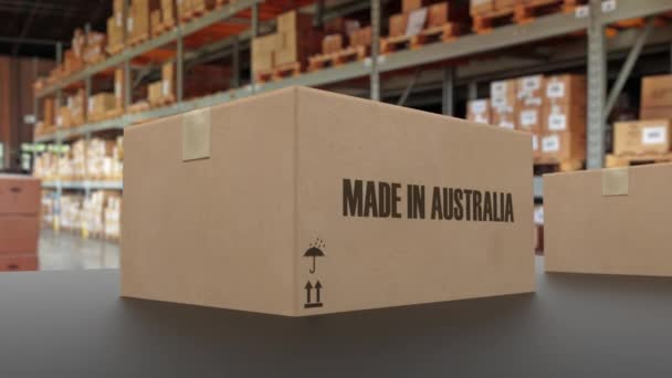 Boxes with MADE IN AUSTRALIA text on conveyor. Australian goods related loopable 3D animation - Кадри, відео