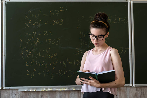 young student explain solving hight math formula on blackboard - Photo, Image