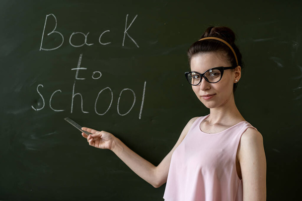 education concept, back to school written on blackboard, university - Foto, afbeelding