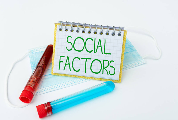 Hand writing sign Social Factors. Word for Things that influences lifestyle Cultural Differences Preparing And Writing Prescription Medicine, Preventing Virus Spread - Photo, Image