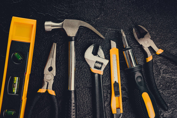 Many different tools for repair work on a black background - Fotografie, Obrázek