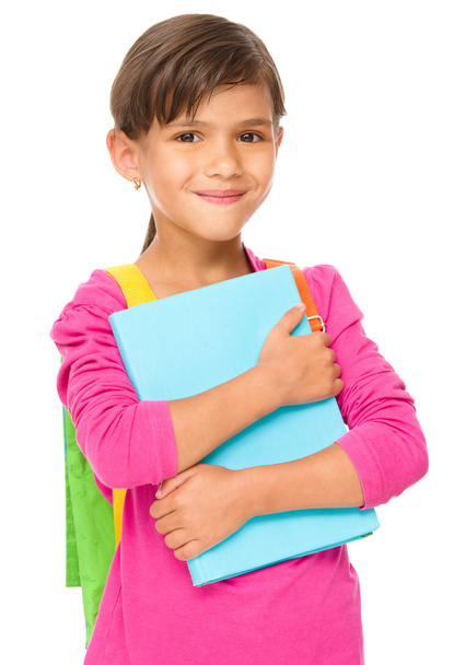 Young girl is holding book - Valokuva, kuva