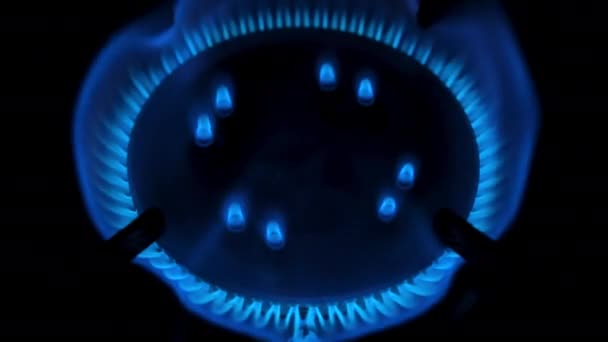 Gas stove being turned on isolated on black background. Natural gas deficit concept. Top view. 4k resolution video - Materiał filmowy, wideo