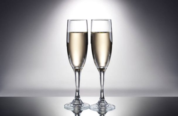 Glasses of champagne with splash, celebration theme concept - Φωτογραφία, εικόνα