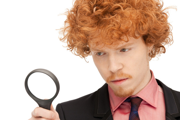 Man with magnifying glass - Foto, afbeelding