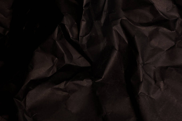 black creased crumpled paper background grunge texture backdrop - Foto, afbeelding