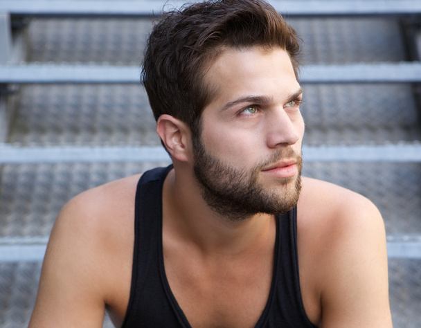 Handsome young man with beard looking away - Photo, Image