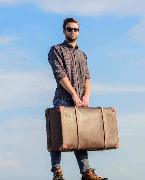 Vacation time. Travel agency. Travel blogger. Man carrying his things in baggage. Business trip. Handsome guy traveler. Travel with luggage. Guy outdoors with vintage suitcase. Luggage concep - Foto, Imagem