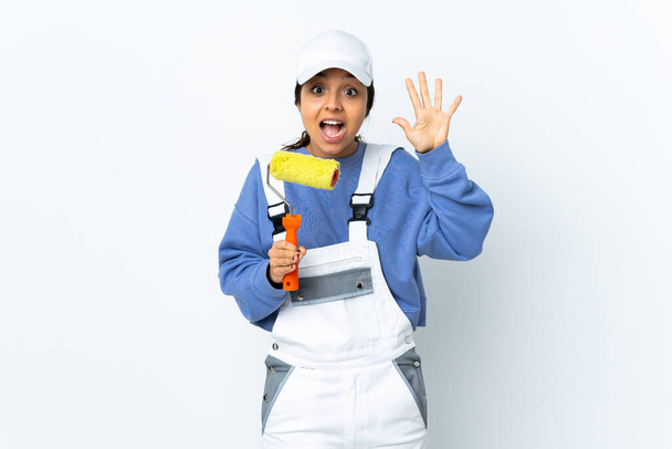 Painter woman over isolated white background counting five with fingers - Foto, immagini