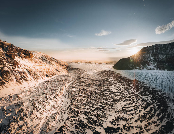 Aerial drone panorama top view glacier iceland svinafellsjoekull and Vatnakokull. Sunset with beautiful sky and lenticular clouds. Melting Ice, Climate Change and Global Warming Concept - Foto, Imagem
