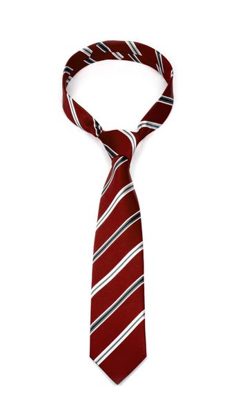 Stylowy wiązany brązowy krawat w paski z szaro-białymi liniami na białym tle - Zdjęcie, obraz