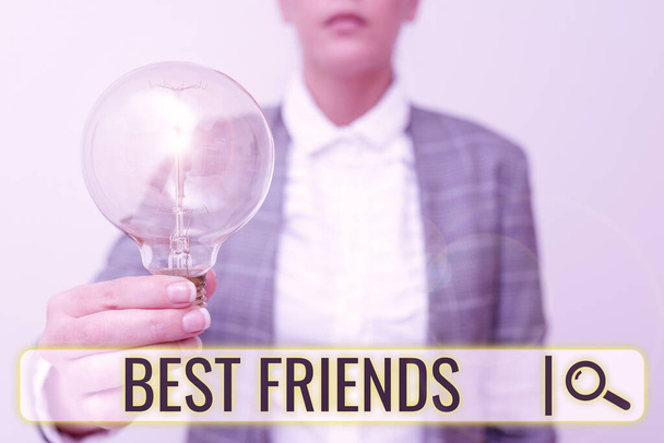 Inspiration showing sign Best Friends. Conceptual photo A person you value above other persons Forever buddies Lady in business outfit holding lamp presenting new technology ideas - Foto, immagini