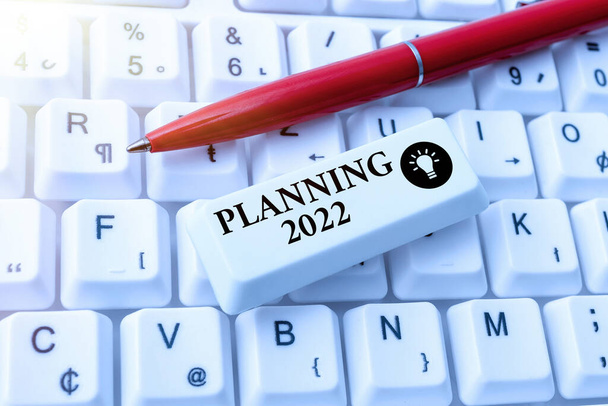 Sign displaying Planning 2022. Business approach Begin with end in the Mind Positioning Long term Objectives Typing Device Instruction Manual, Posting Product Review Online - Photo, Image