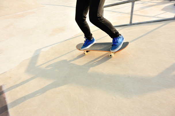 Skateboarding legs at skatepark - Fotoğraf, Görsel