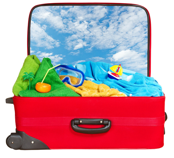 Travel red suitcase packed for summer vacation - Foto, Imagem
