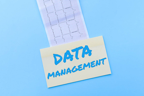 Conceptual display Data Management. Business idea The practice of organizing and maintaining data processes Reading Graph And Writing Important Medical Notes Test Result Analysis - Photo, Image