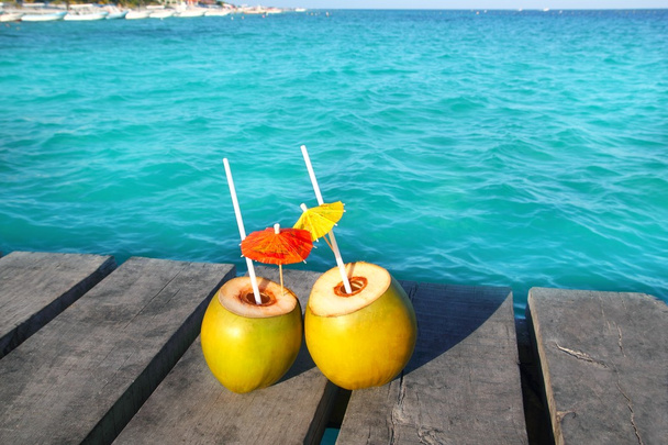Coconut coktails in caribbean on wood pier - Photo, image
