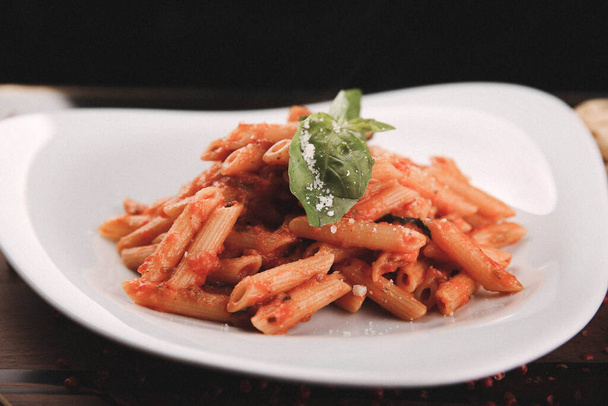 Tasty appetizing classic Italian pasta with a delicious sauce. - Fotografie, Obrázek