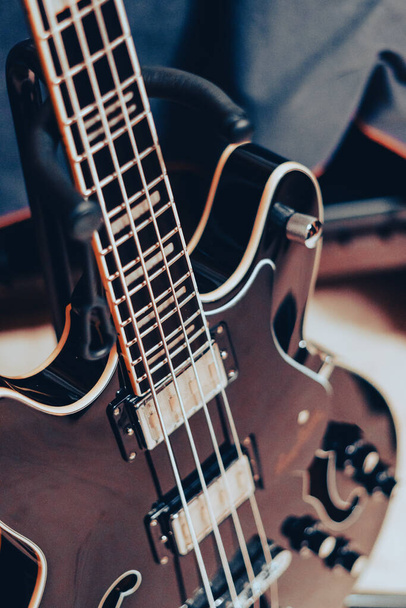 Close-up detail of a four-string electric bass guitar - 写真・画像