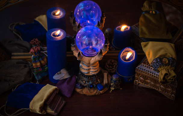 Candle burns on the altar, magic among candles, clean energy, magical concept - Fotó, kép