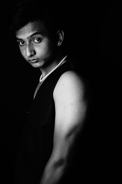 portrait of a young man on a dark background - Zdjęcie, obraz