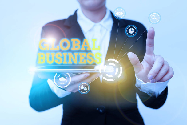 Hand writing sign Global Business. Internet Concept Trade and business system a company doing across the world Woman In Suit Holding Tablet Pointing Finger On Futuristic Virtual Button. - Photo, Image