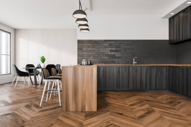 Modern cooking interior with sink and deck with dishes, black chairs and table on parquet floor, wooden shelves and window with city view, 3D rendering - Foto, immagini