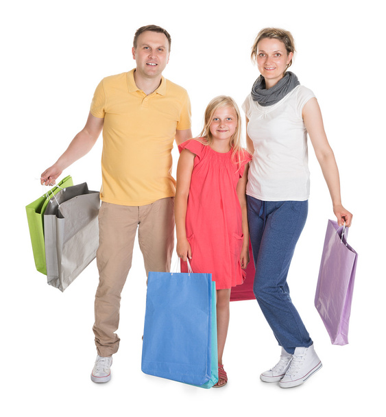 Young Family Shopping Together - Φωτογραφία, εικόνα