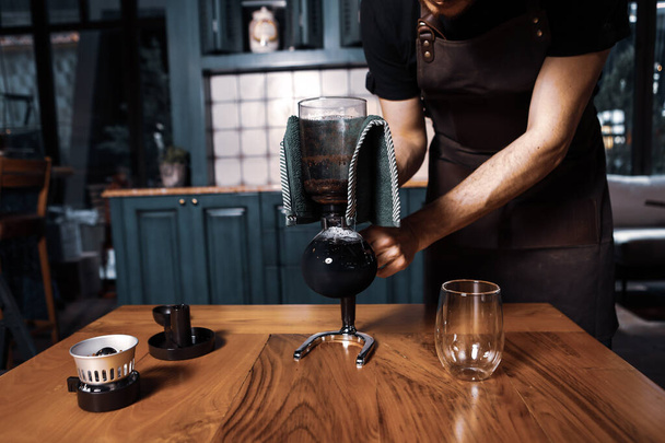 barista brewing coffee in the coffee room - Foto, Imagen