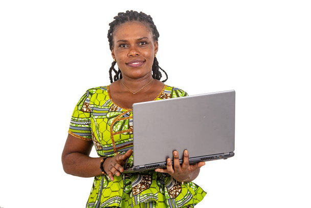 beautiful young businesswoman holding laptop computer while smiling. - Foto, afbeelding