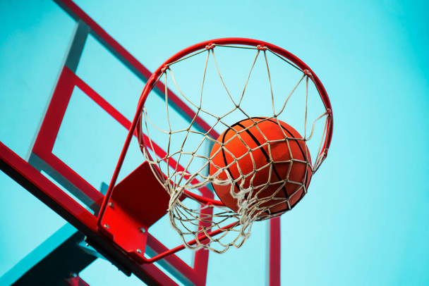 A basketball in the net. The fly ball is in the ring. A sports game.  - Foto, immagini