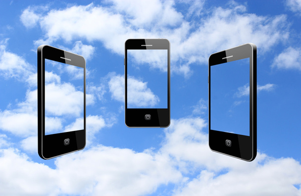 drei moderne Mobiltelefone am Himmel - Foto, Bild