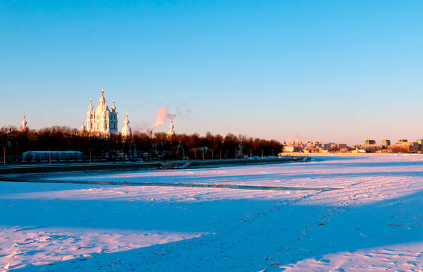 View to Smolny Cathedral and Neva river. Sunny winter day. Sankt Petersburg, Russia.  - Фото, изображение