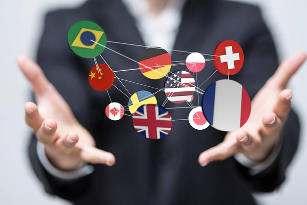 A 3D rendered stickers of different countries hovering over a person's hands - Φωτογραφία, εικόνα