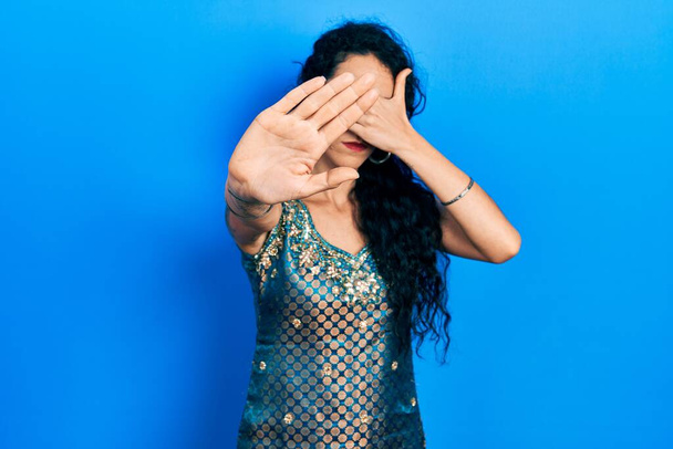 Young woman wearing bindi and traditional kurta dress covering eyes with hands and doing stop gesture with sad and fear expression. embarrassed and negative concept.  - Fotografie, Obrázek