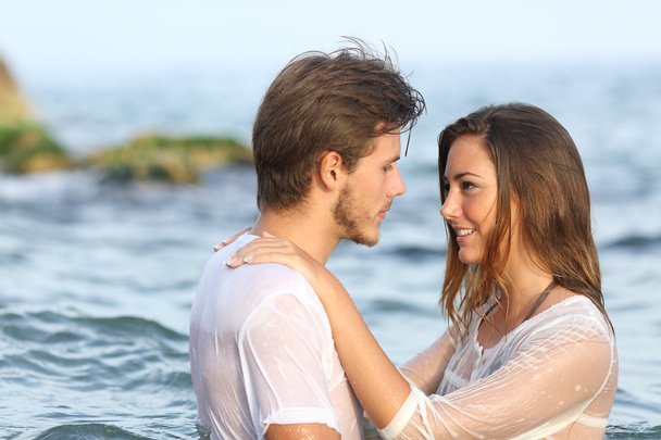 Young couple in love bathing in the sea - Foto, Imagen